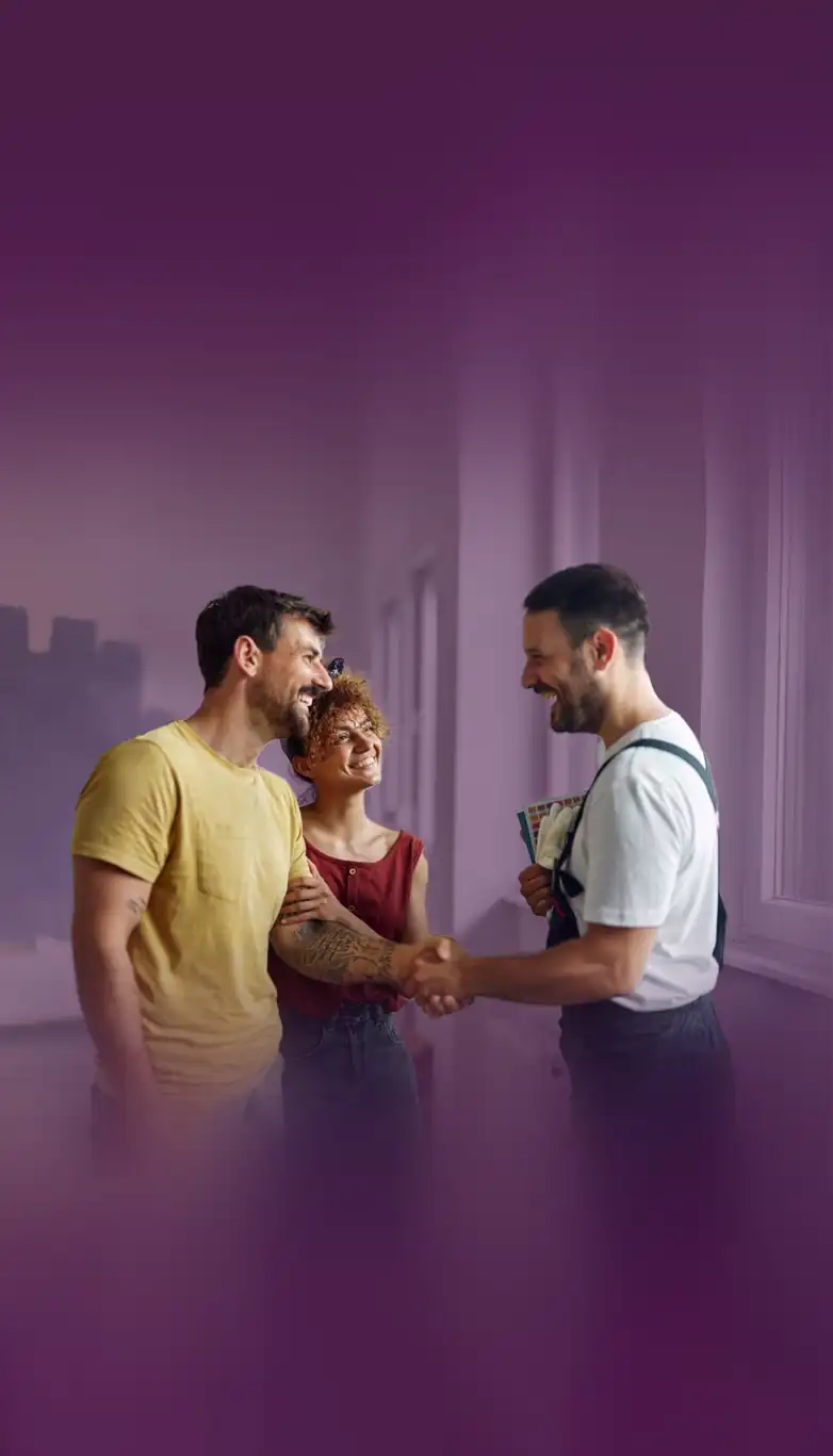 The Elegant Edge team greeting happy homeowners after a project