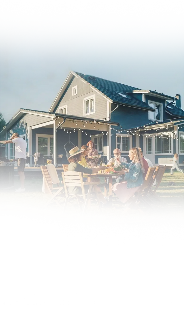 A family gathered outside their beautifully painted two-story home