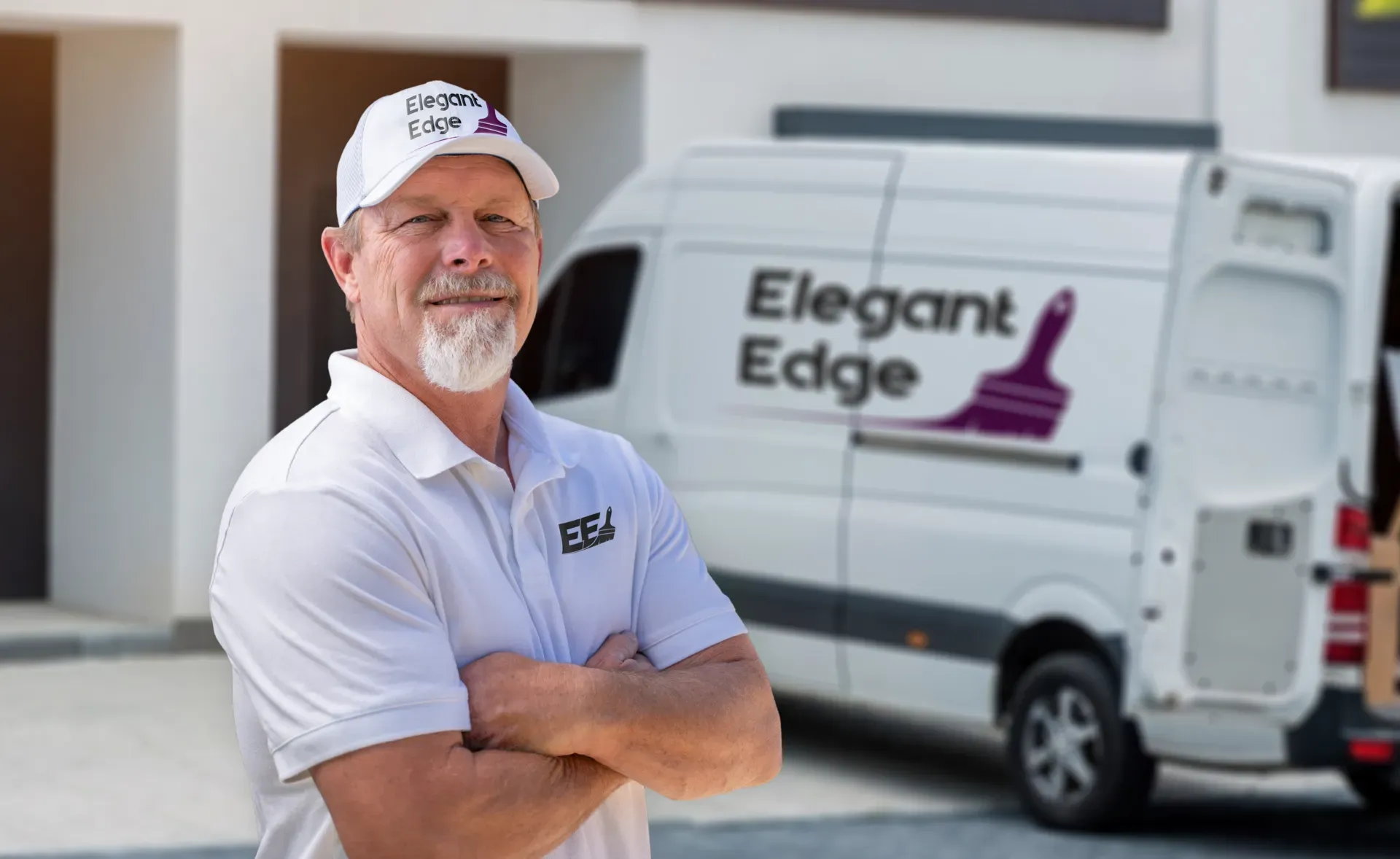 Pat Dougherty, Chief Painter, beside the Elegant Edge van
