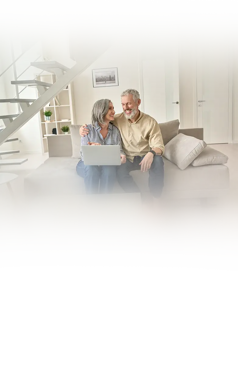 A happy couple relaxing in their freshly painted living room